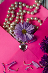pink paper envelope with flowers and pearls