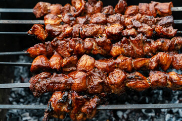 BBQ pork skewers closeup. Grilled pork covered with barbecue sauce.