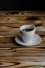 espresso on wooden background with star anise and cinnamon