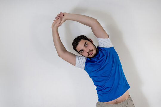 man doing stretching exercises with his arms