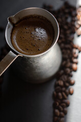 coffee cezve with fresh coffee and beans
