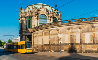 City tram passes by The Zwinger Palace in Dresden, Germany