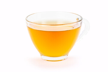 glass of orange herbal tea isolated on white background.