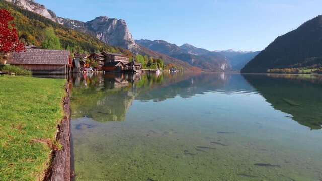 Colorful morning view of Grundlsee lake. Sunny autumn scene of small fishing village - Roslern, Liezen District of Styria, Austria. Traveling concept background. Full HD video (High Definition).
