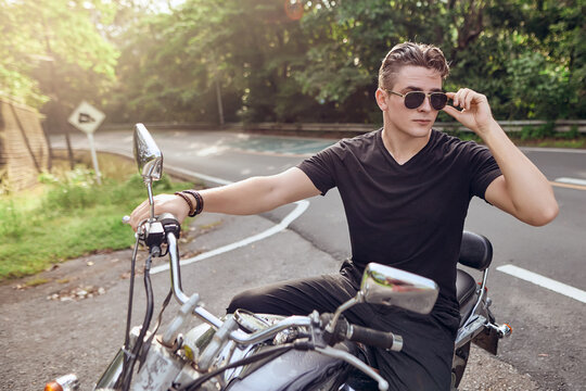  Portrait Of A Guy Sitting On A Motorcycle                              
