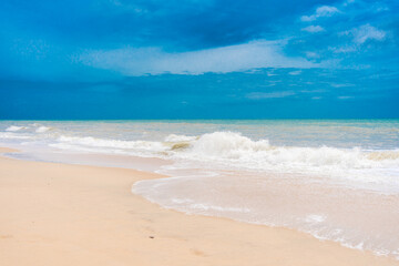 Artistic beautiful surreal colors blurred beach abstract background with water wave.