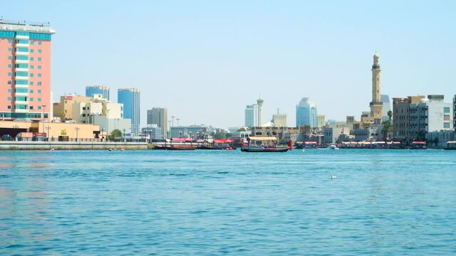  The abra boats float between Deira Old Souk and Bur Dubai district, separated by Dubai Creek, UAE