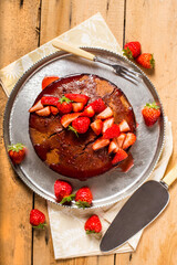 strawberries cale over rustic wooden boars