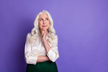 Portrait of pensive old lady touch chin hands think thoughts try decide solutions wear white shirt...