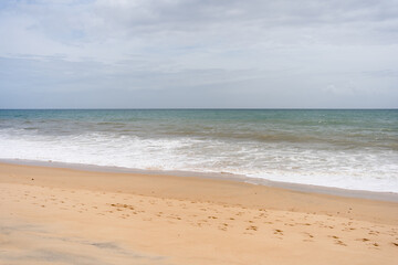 Artistic beautiful surreal colors blurred beach abstract background with water wave.