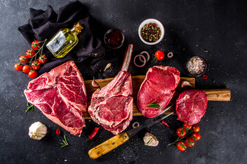 Set of various classic, alternative raw meat, veal beef steaks - chateau mignon, t-bone, tomahawk,...