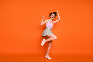 Full size photo of cheerful delighted girl hear incredible corona virus victory news raise fists wear good look outfit isolated over bright color background