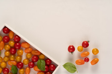 Top view of cherry tomatoes in small wooden crate
