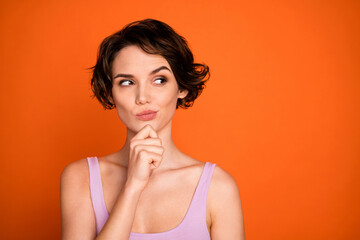 Portrait of minded interested smart girl look copyspace touch hand chin think thoughts decision...