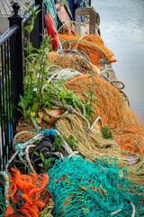 Colourful fishing nets on quay side