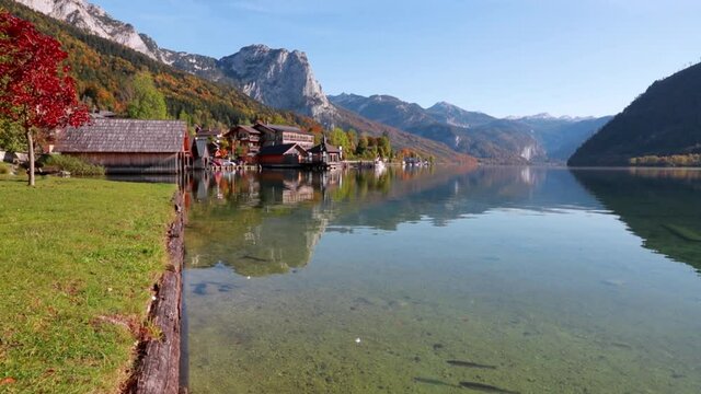 Astonishing sunny day on Grundlsee lake. Beautifel autumn view of small fishing village - Roslern, Liezen District of Styria, Austria, Europe. Full HD video (High Definition).
