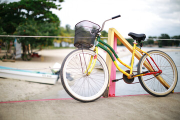 Fototapeta na wymiar Old bicycle with colorful tradition Caribbean style in Mexico on the beach