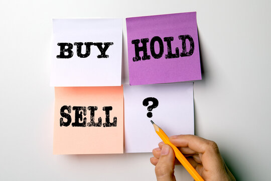 BUY, HOLD, SELL concept. Colored sticky notes