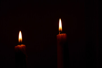 candles that are lit in the dark