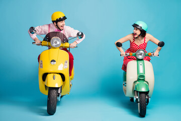 Full size photo of rushing funny lady guy couple drive retro moped big speed competitive travelers easy way good mood vintage outfit protective caps isolated blue color background