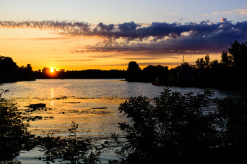 Fototapeta premium Sunset over the bay of river Dnieper in Kiev, Ukraine