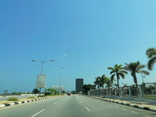View of marginal Luanda road in the Luanda city downtown center with road, vehicles and buildings