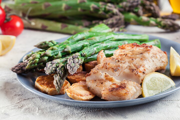 Fried cod fillet with green asparagus