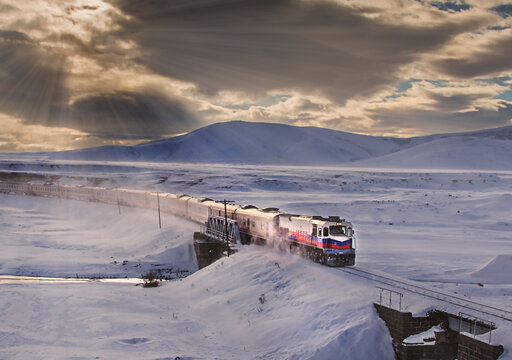 Kars, Turkey - January, 2018: Ankara-Kars (Diesel Train) Eastern Express train in the winter with sunrise. The travel of Eastern Express (Dogu Ekspresi) takes 24 hours between Ankara and Kars.