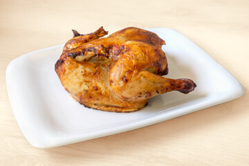 whole roasted chicken isolated on white background