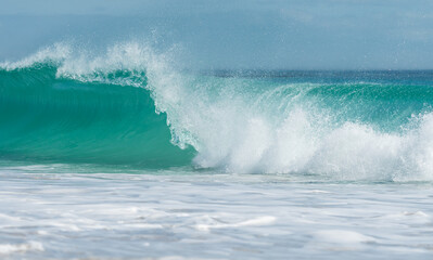 turquoise wave or roller breaking in the ocean concept tropical Summer holiday or vacation