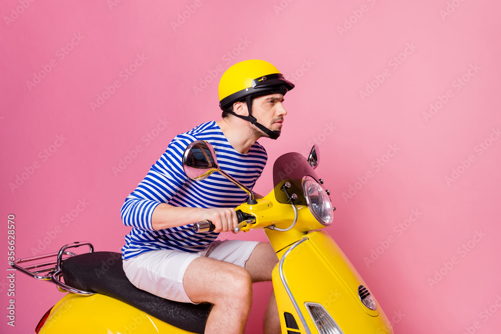 Poster Profile side view of his he nice attractive handsome focused concentrated guy driving moped hurrying up meeting appointment isolated over pink pastel color background