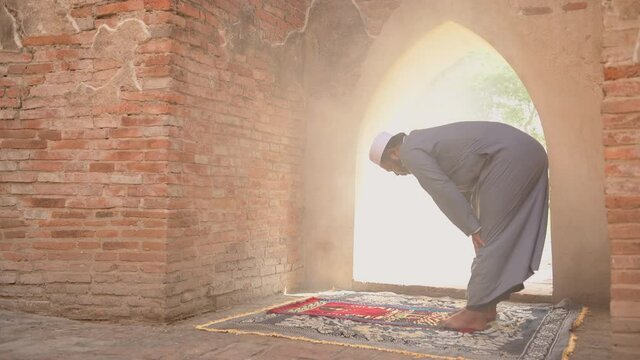 Muslim Young man praying at an old mosque in Ayutthaya, Thailand