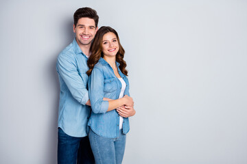 Photo two people lady handsome guy standing cuddle hugging together holding hands romantic feelings wear casual denim shirts outfit isolated grey color background
