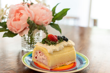 Obraz na płótnie Canvas Cake Rolls decorated with fruit, strawberry, blueberries, raspberries.