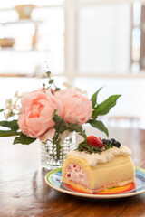 Cake Rolls decorated with fruit, strawberry, blueberries, raspberries.