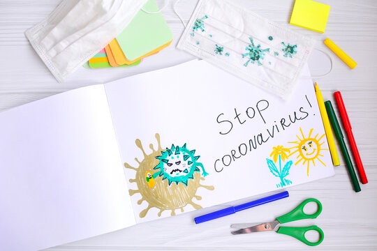 Children's drawing of the coronavirus molecule with felt-tip pens in the album. Viral disease prevention concept.