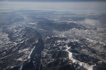 Obraz premium Snowcapped mountains photographed from a plane