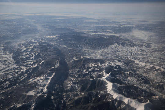 Snowcapped mountains photographed from a plane