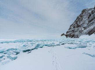 Beautiful crack that goes beyond the horizon on the ice of lake Baikal.