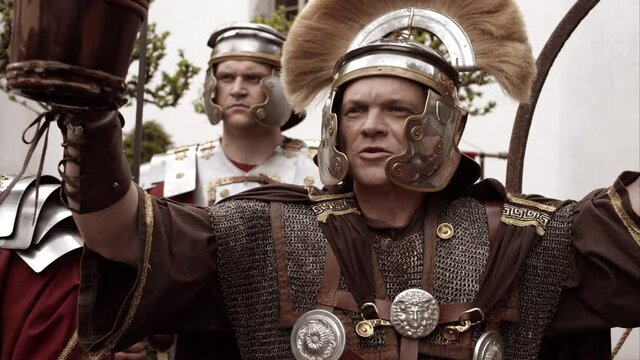 Roman Soldier Holding A Drink And Cheering Excitedly