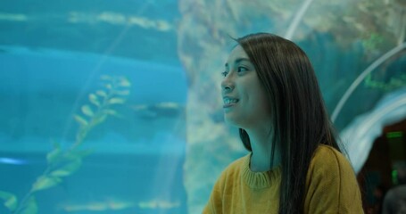 Woman visits aquarium in zoo park