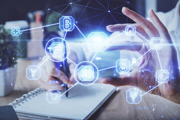 Social network theme hologram over woman's hands writing background. Concept of international people connect. Double exposure