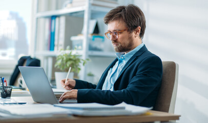 Young businessman working on a laptop