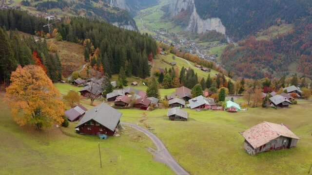 4k drone forward video (Ultra High Definition) of Wengen village, district of Lauterbrunnen. Awesome morning scene of Swiss Alps. Aerial autumn landscape of Switzerland countryside, Europe. 