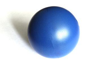 Blue toy ball on a white background. Isolated little ball.