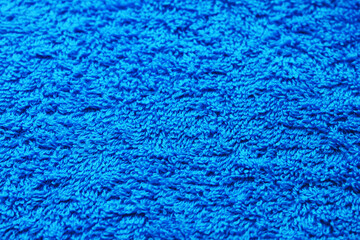 Bath paper towel texture background. Bright blue woven terry cloth material design. Light blue soft wool towel pattern, new bath item close up detailed view