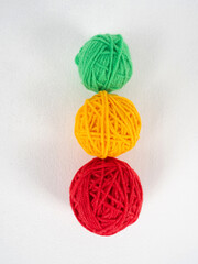 multicolored yarn balls on white background