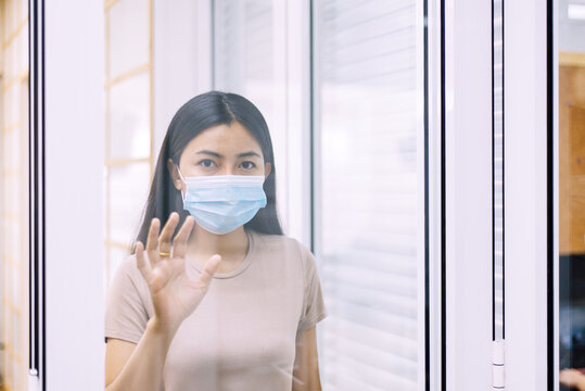 Asian woman stay at home during coronavirus and covid-19 epidemic or pandemic,Social distancing concept