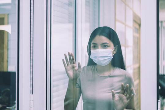 Asian woman stay at home during coronavirus and covid-19 epidemic or pandemic,Social distancing concept
