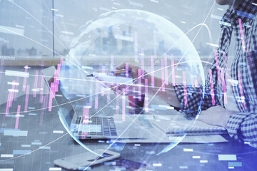 Multi exposure of stock market chart with man working on computer on background. Concept of financial analysis.